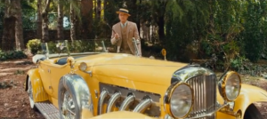 Jay and yellow car The Great Gatsby 2013 - fashion in film.PNG